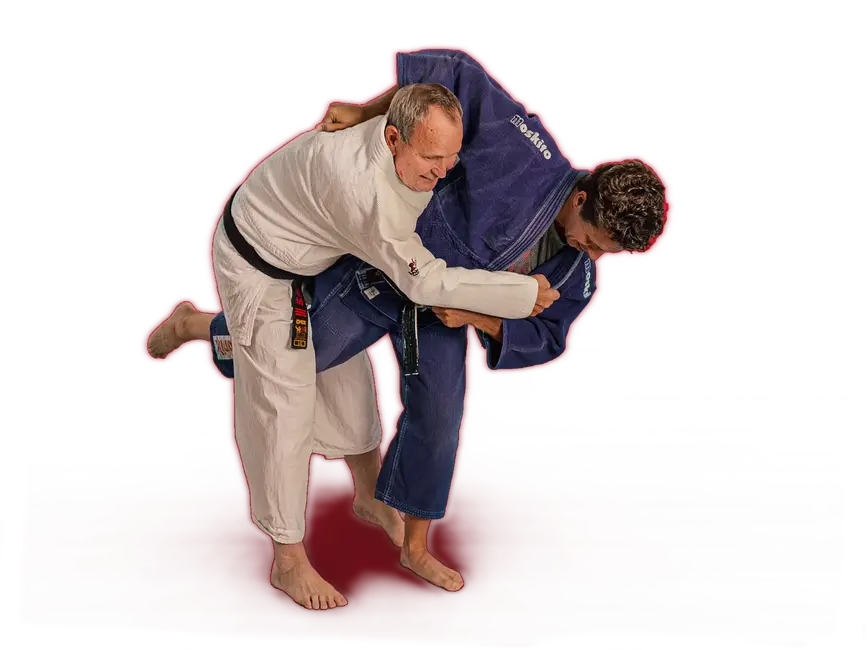 Zwei Judokas im weißen und blauen Gi üben Techniken im Sportverein Turngemeinde Landshut.