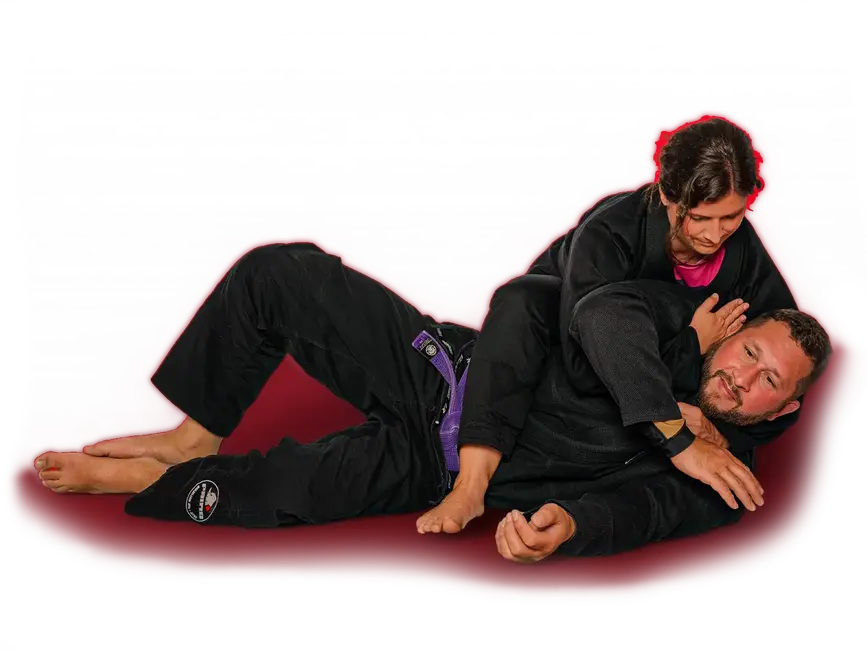 Zwei Personen üben Brazilian Jiu-Jitsu, eine Sportart des Vereins Turngemeinde Landshut, auf einer Matte.