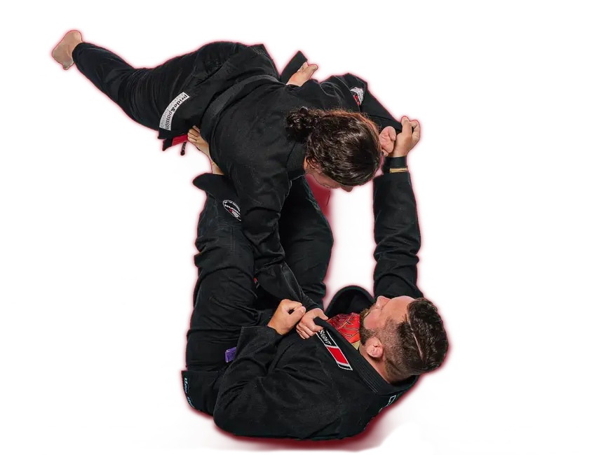 Zwei Personen üben Brazilian Jiu-Jitsu, eine Sportart des Vereins Turngemeinde Landshut, auf einer Matte.